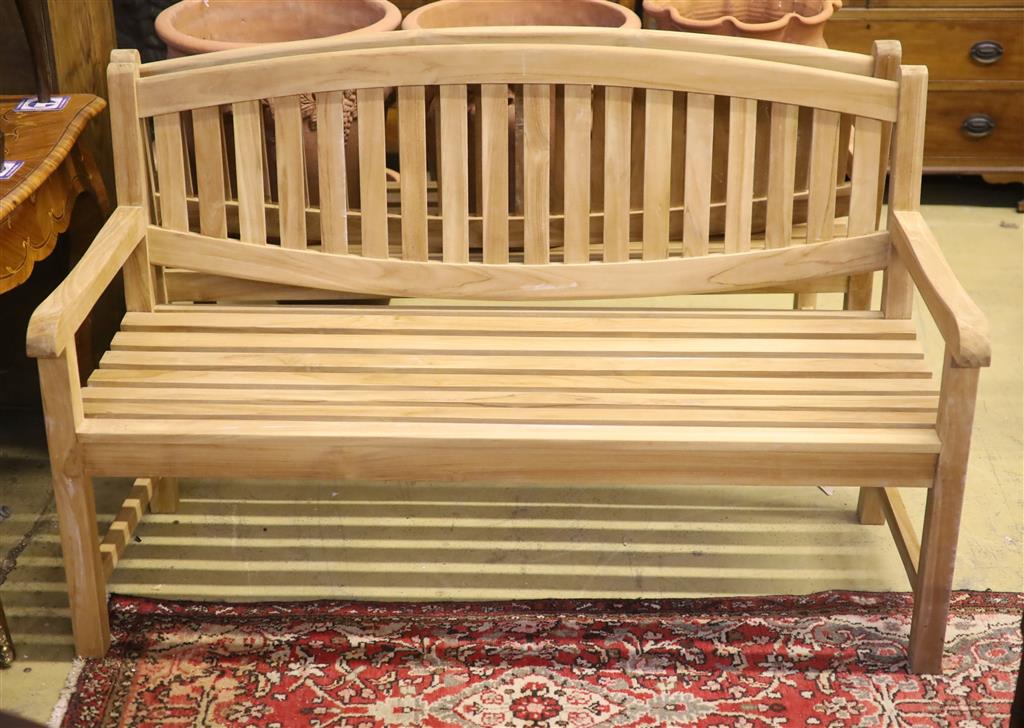 A brand new teak garden bench, length 150cm, depth 62cm, height 92cm